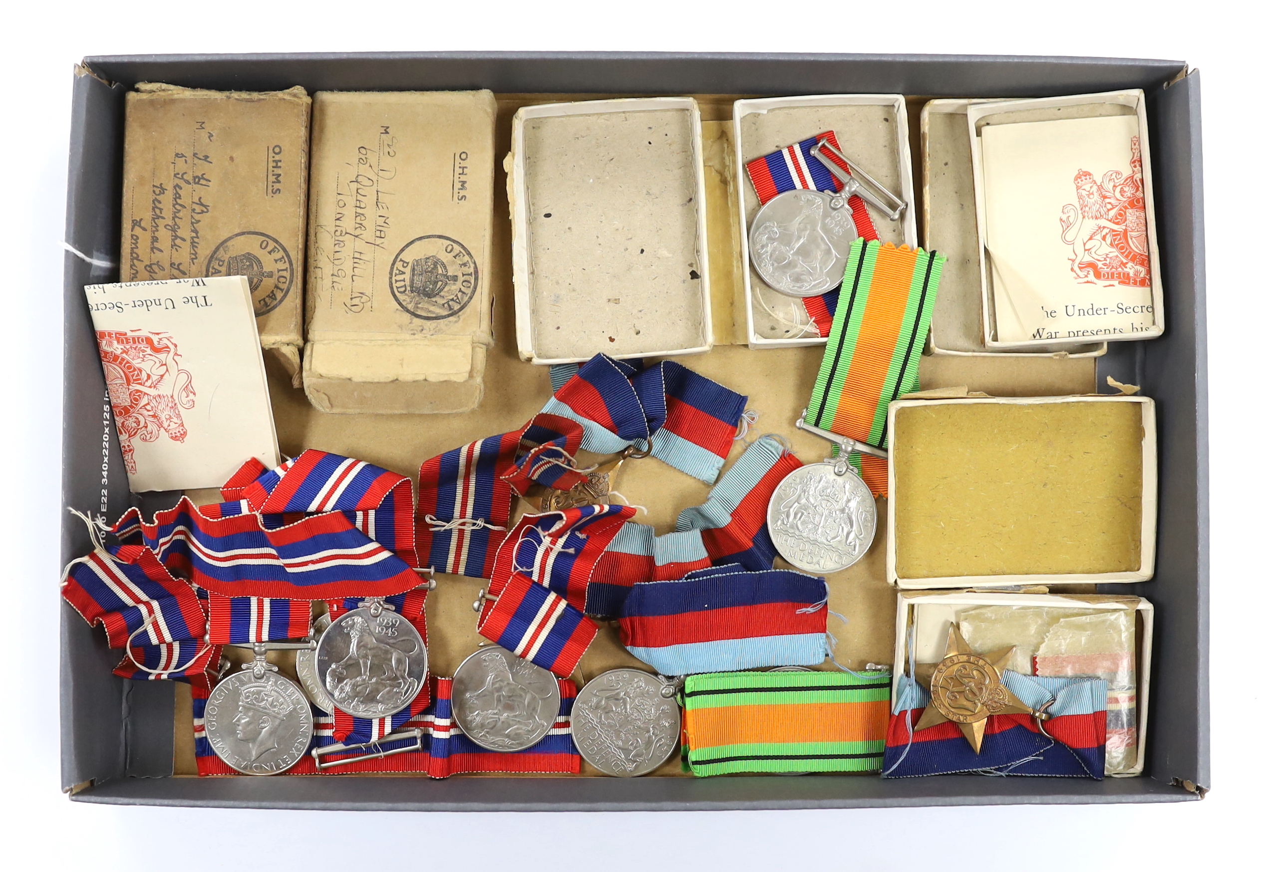 Fifteen WWII medals including some with original card boxes, including; eight War medals, three Defence medals and four 1939-1945 Stars